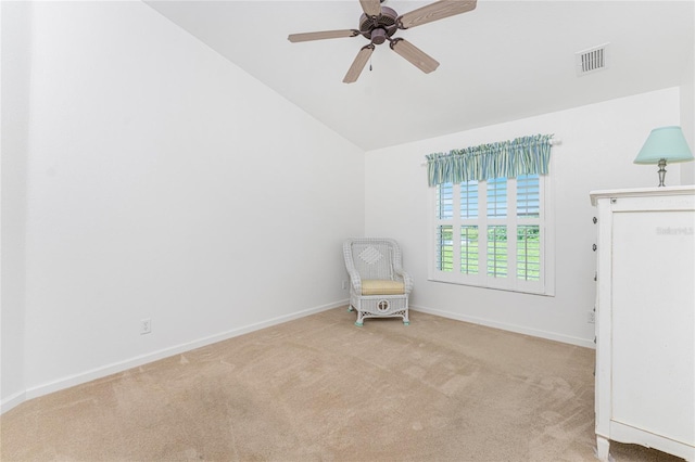 unfurnished room featuring lofted ceiling, ceiling fan, and light colored carpet