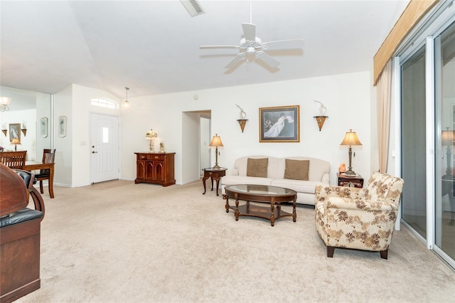 living room featuring light carpet and ceiling fan