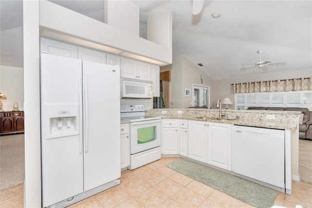 kitchen with white appliances, white cabinetry, ceiling fan, and kitchen peninsula