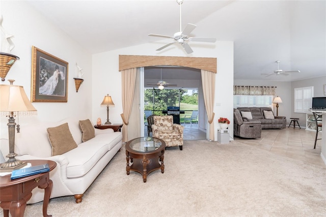 living room with vaulted ceiling, ceiling fan, and light tile patterned floors