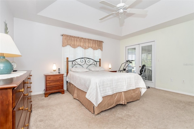 bedroom with ceiling fan, light colored carpet, and access to exterior