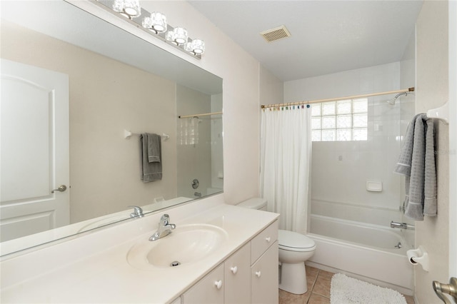 full bathroom with shower / tub combo, tile patterned flooring, vanity, and toilet