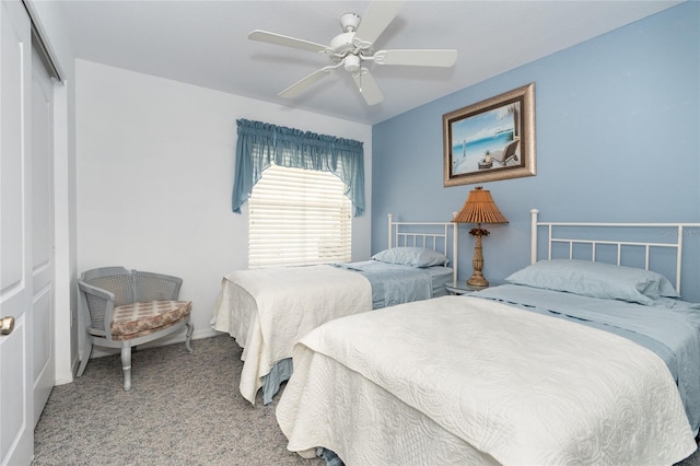 bedroom with carpet, ceiling fan, and a closet