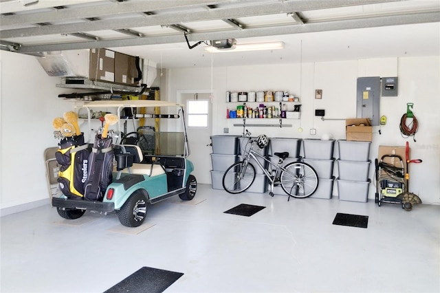 garage with electric panel and a garage door opener