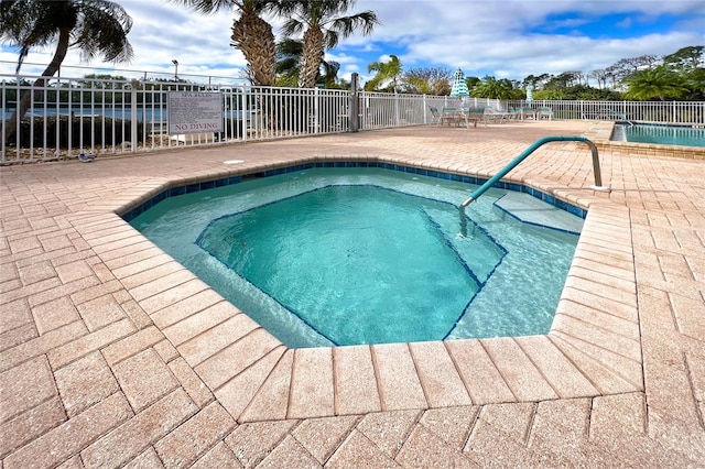 view of swimming pool featuring a patio