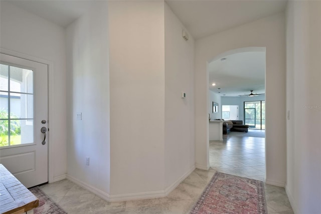 interior space featuring ceiling fan and light tile patterned floors