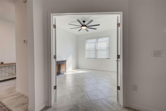 corridor featuring light tile patterned floors