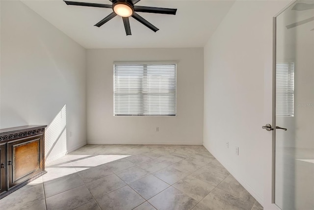 tiled empty room with ceiling fan