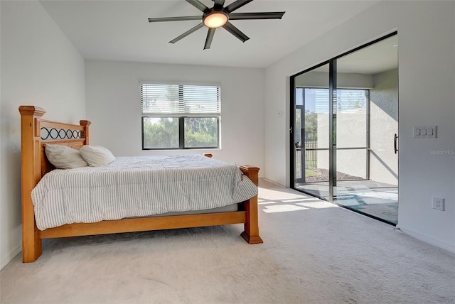 carpeted bedroom with access to outside, multiple windows, and ceiling fan