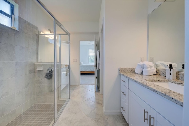 bathroom featuring vanity, tile patterned floors, and an enclosed shower