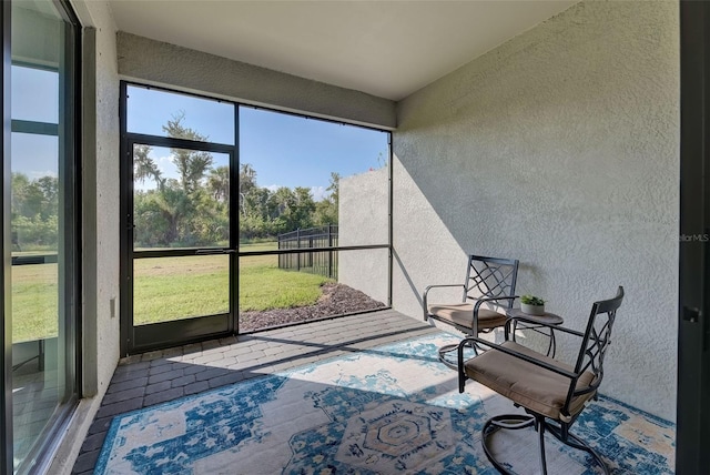 unfurnished sunroom featuring a wealth of natural light