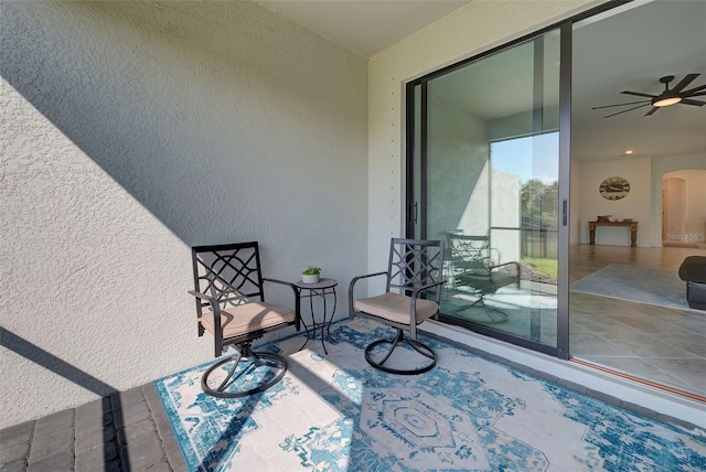 exterior space featuring ceiling fan