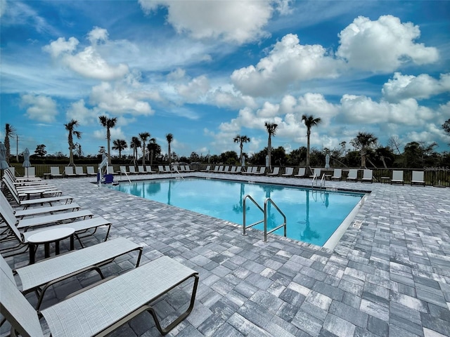 view of swimming pool with a patio