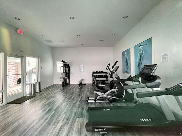 workout area with hardwood / wood-style flooring