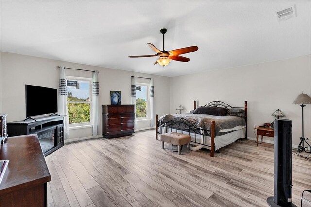 bedroom featuring light wood-type flooring and ceiling fan