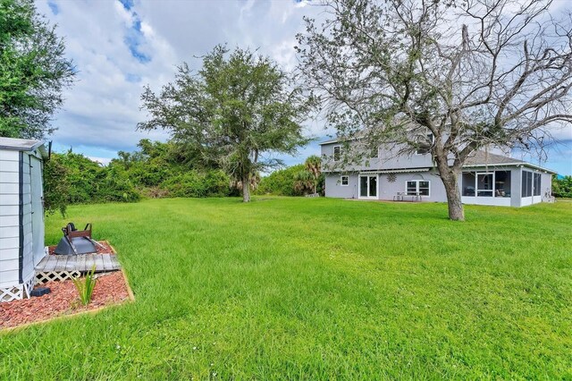 view of yard with a sunroom