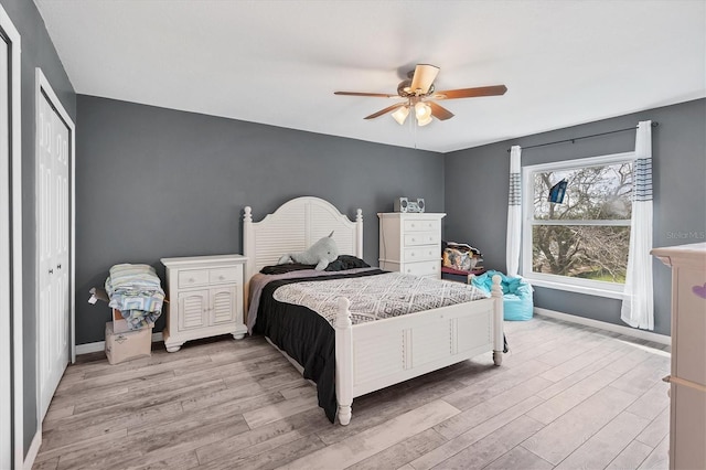 13401 Galveston Ave, Port Charlotte, FL 33981 - bedroom with light wood-style flooring, baseboards, a ceiling fan, and a closet