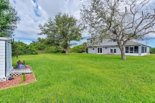 13401 Galveston Ave, Port Charlotte, FL 33981 - view of grassy yard with a sunroom