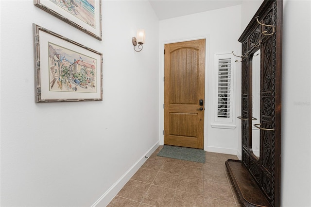 11100 Hacienda Del Mar Blvd Unit 202, Placida, FL 33946 - doorway with tile patterned flooring and baseboards