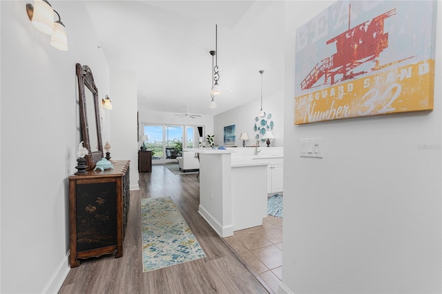 11100 Hacienda Del Mar Blvd Unit 202, Placida, FL 33946 - hallway with baseboards and wood finished floors