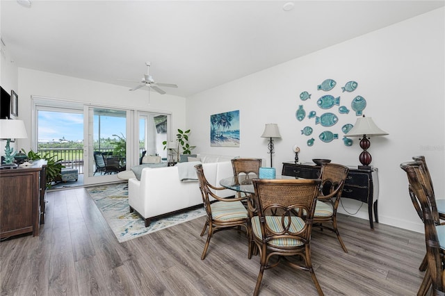 11100 Hacienda Del Mar Blvd Unit 202, Placida, FL 33946 - dining room with baseboards, wood finished floors, and a ceiling fan