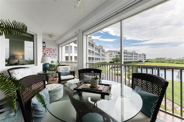 11100 Hacienda Del Mar Blvd Unit 202, Placida, FL 33946 - sunroom / solarium with outdoor lounge area, a water view, and ceiling fan