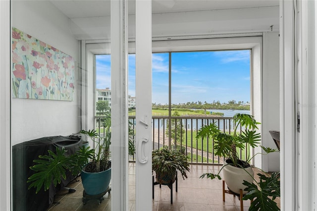 11100 Hacienda Del Mar Blvd Unit 202, Placida, FL 33946 - sunroom / solarium with a water view and a healthy amount of sunlight