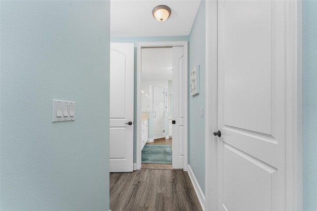 11100 Hacienda Del Mar Blvd Unit 202, Placida, FL 33946 - hallway featuring baseboards and wood finished floors