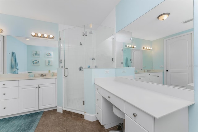11100 Hacienda Del Mar Blvd Unit 202, Placida, FL 33946 - full bath featuring vanity, visible vents, tile patterned floors, and a shower stall