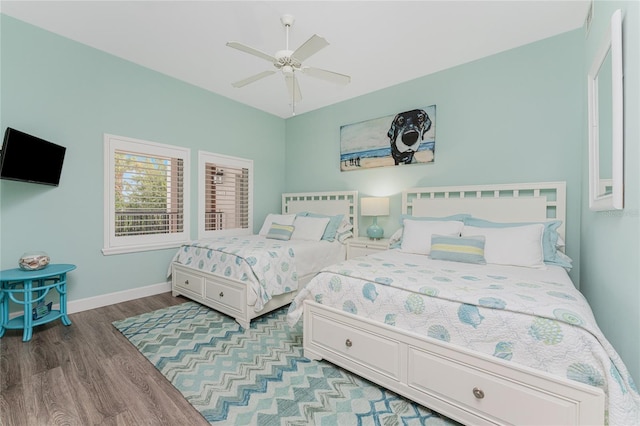11100 Hacienda Del Mar Blvd Unit 202, Placida, FL 33946 - bedroom with baseboards, wood finished floors, and ceiling fan