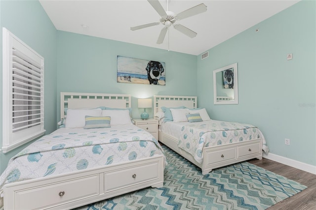 11100 Hacienda Del Mar Blvd Unit 202, Placida, FL 33946 - bedroom with baseboards, visible vents, wood finished floors, and a ceiling fan