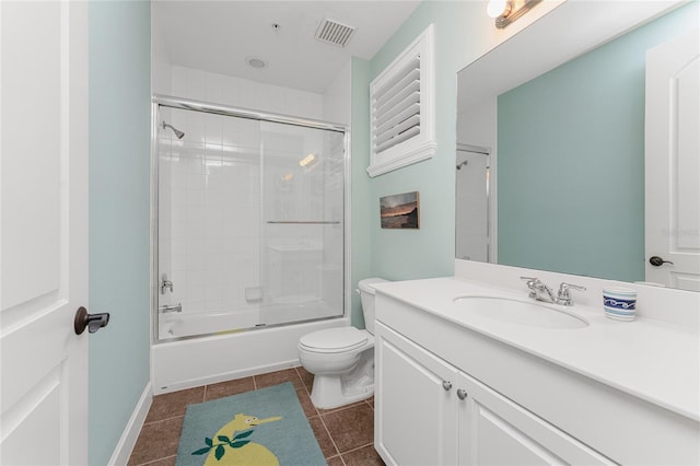 11100 Hacienda Del Mar Blvd Unit 202, Placida, FL 33946 - full bath featuring vanity, toilet, tile patterned floors, visible vents, and combined bath / shower with glass door