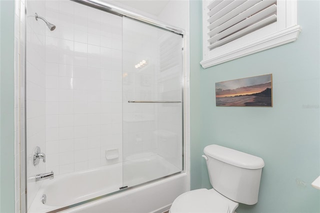 11100 Hacienda Del Mar Blvd Unit 202, Placida, FL 33946 - bathroom featuring combined bath / shower with glass door and toilet