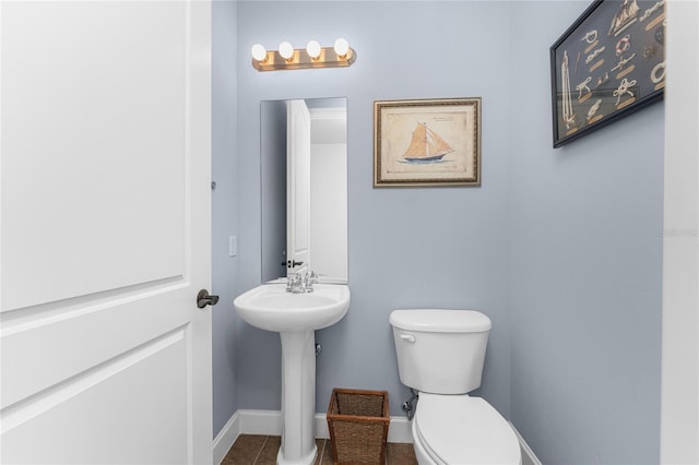 11100 Hacienda Del Mar Blvd Unit 202, Placida, FL 33946 - bathroom featuring baseboards, toilet, and tile patterned floors