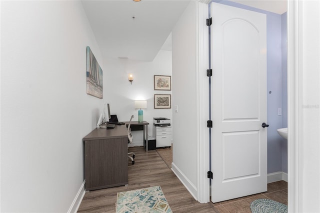 11100 Hacienda Del Mar Blvd Unit 202, Placida, FL 33946 - home office with baseboards and wood finished floors