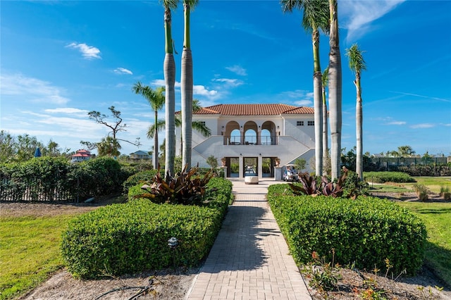 11100 Hacienda Del Mar Blvd Unit 202, Placida, FL 33946 - view of front facade with a tiled roof, a balcony, and stucco siding