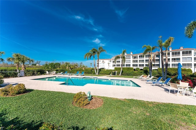 11100 Hacienda Del Mar Blvd Unit 202, Placida, FL 33946 - community pool featuring a lawn and a patio area