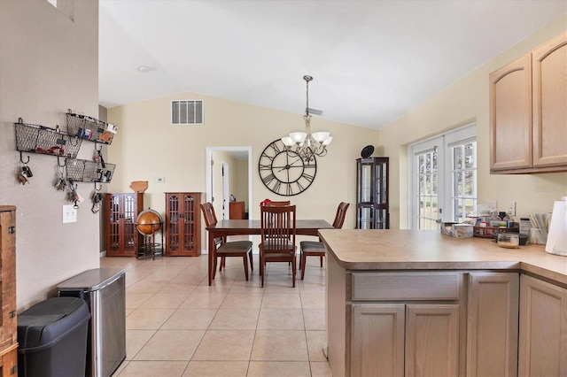 kitchen with decorative light fixtures, light tile patterned floors, light countertops, visible vents, and light brown cabinetry