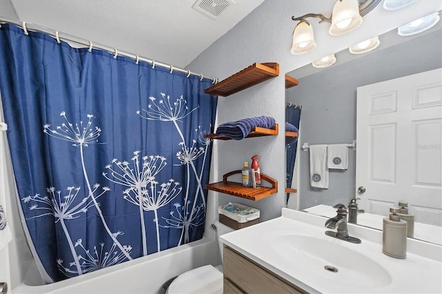 full bathroom featuring visible vents, a textured wall, toilet, shower / bath combo, and vanity