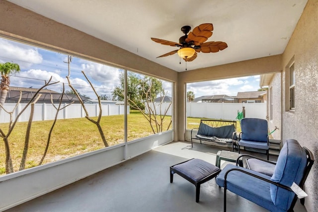 sunroom / solarium with ceiling fan and plenty of natural light