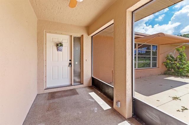 entrance to property with a patio