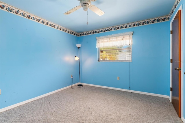 carpeted empty room with ceiling fan