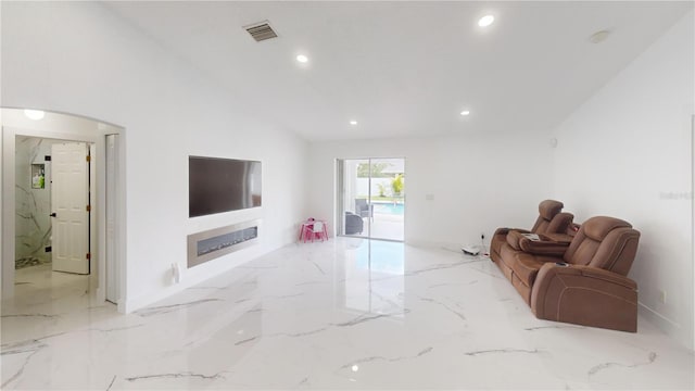 living room with lofted ceiling