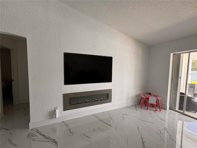 unfurnished living room with a textured ceiling