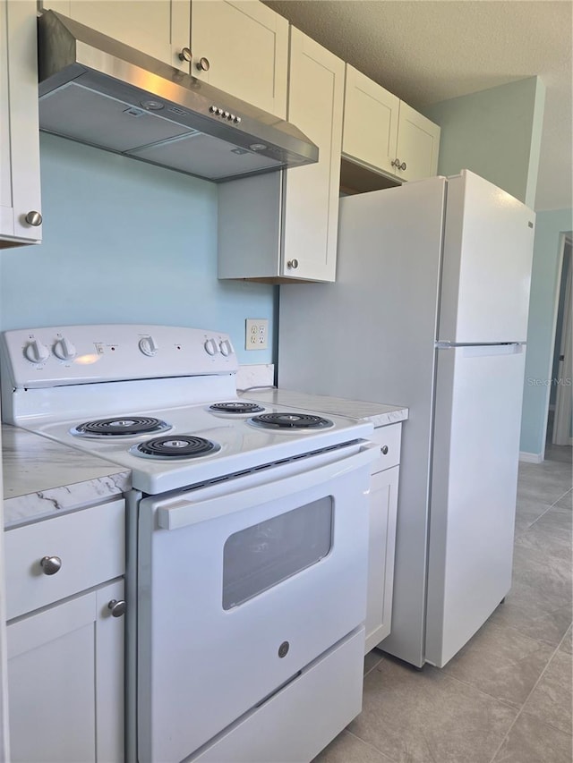 kitchen featuring a textured ceiling, white cabinetry, light stone counters, white electric range oven, and light tile patterned floors