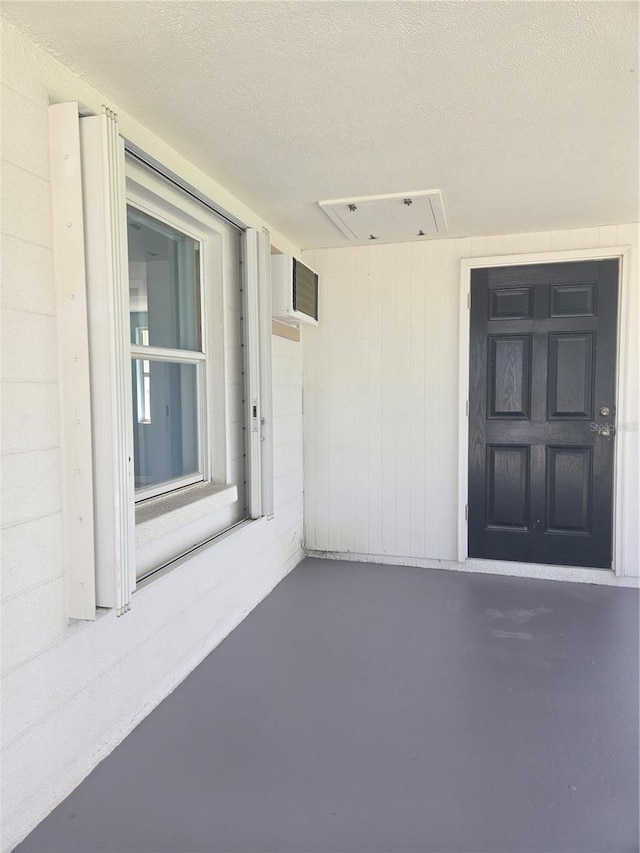 entrance to property with a wall mounted air conditioner