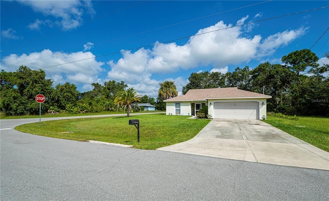 ranch-style home with an attached garage, a front lawn, stucco siding, and driveway