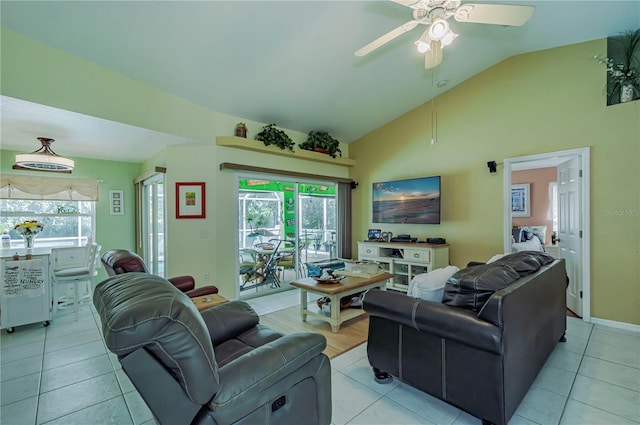 tiled living room with ceiling fan and vaulted ceiling