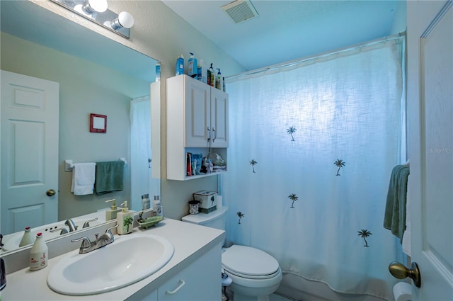 full bathroom with vanity, toilet, and shower / tub combo with curtain