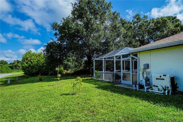 view of yard featuring glass enclosure